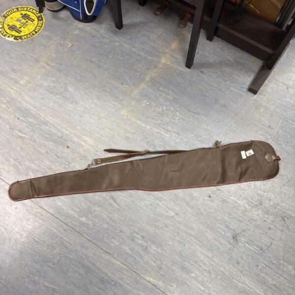 Vintage leather gun slip for firearm storage and transport.