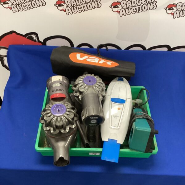 Selection of vacuum cleaners including a Dyson model for sale.