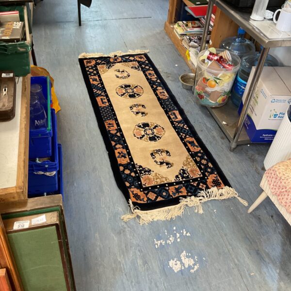 Blue floral wool runner rug with traditional pattern.