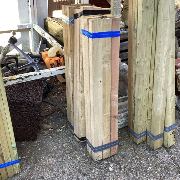 Three bundles of timber for garden and DIY projects.