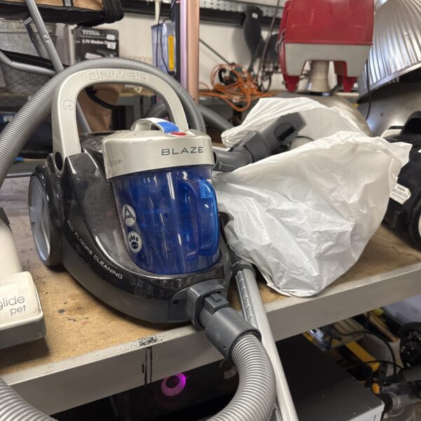 Used Blaze cylinder vacuum cleaner with attachments for home cleaning.