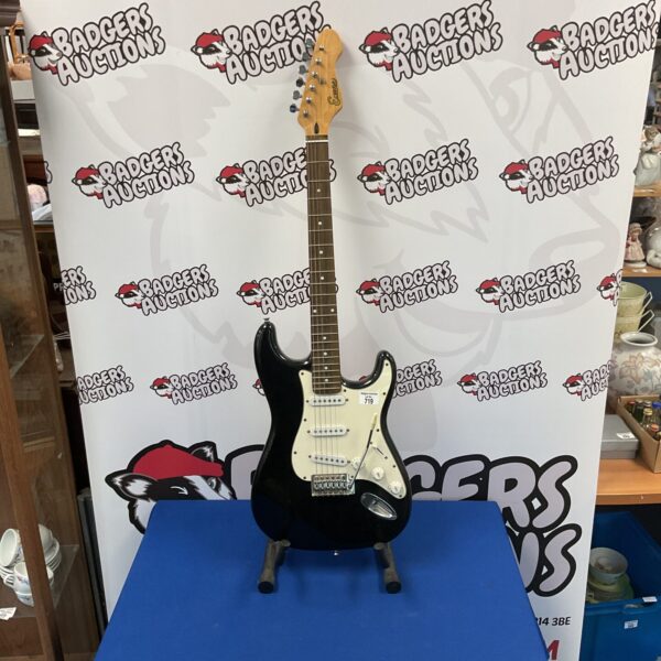 Black Encore electric guitar, a used musical instrument.