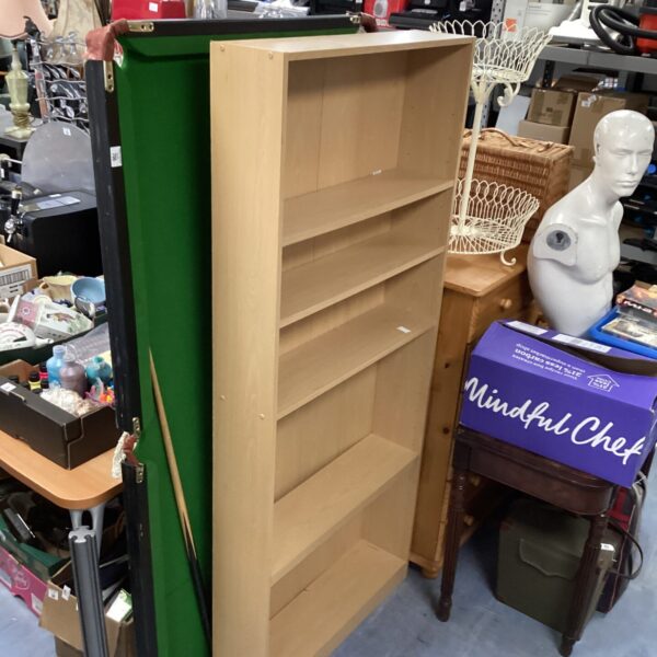 Front view of a light oak effect bookcase with multiple shelves.