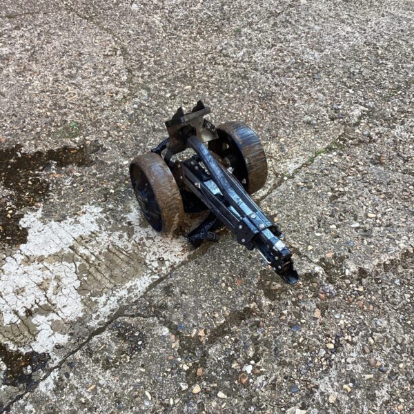 Used folding golf trolley with three wheels for golf equipment.