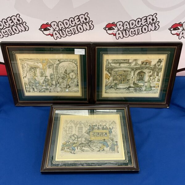 Framed Anton Pieck print of a whimsical Dutch street scene.