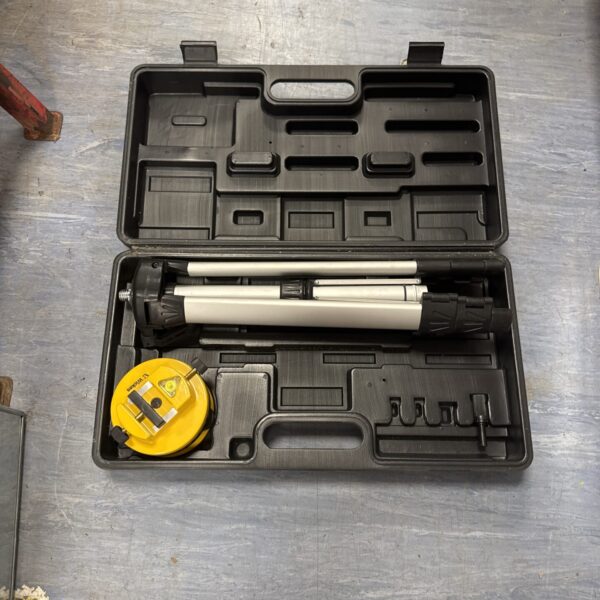 Wickes laser level with tripod inside its carrying case.