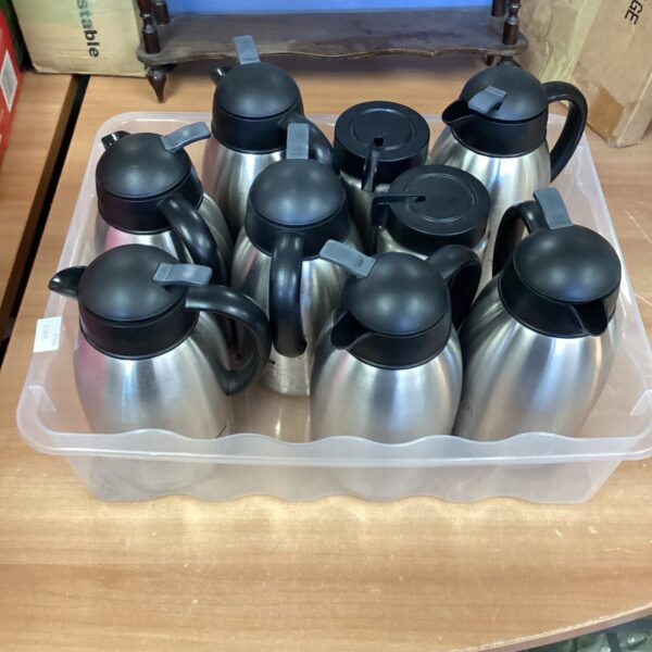 Quantity of stainless steel tea and coffee pots in a lot.