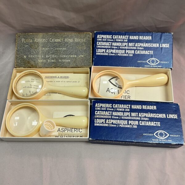 Vintage aspheric cataract hand reader magnifying glass, medical instrument.