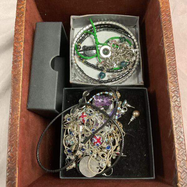 Assorted mixed jewellery lot with necklaces and charms.