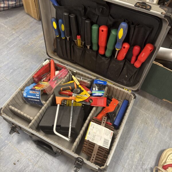 Silver electrician's tool kit with various hand tools inside.