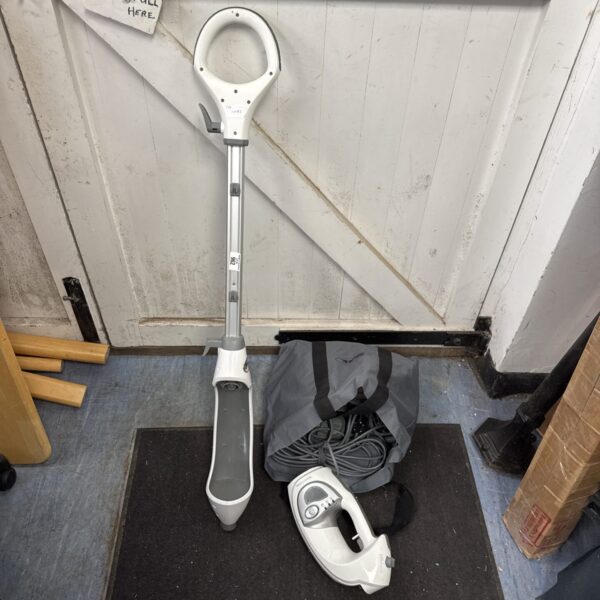 Used Shark handheld steam cleaner for floor and surface cleaning.