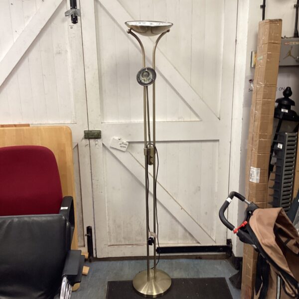 Vintage brass floor lamp with classic design.