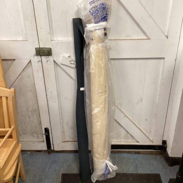 Two rolls of fabric on cardboard cores.