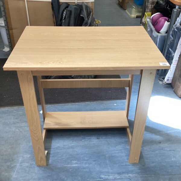 Small wooden desk for bedside or home office use.