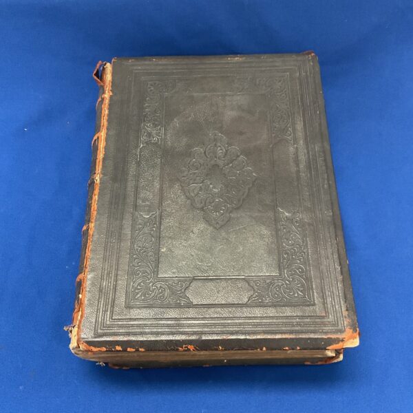 Antique 1892 Holy Bible cover with embossed detail.