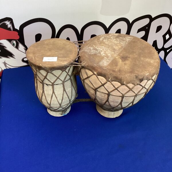 Pair of traditional Moroccan clay drums with leather straps.