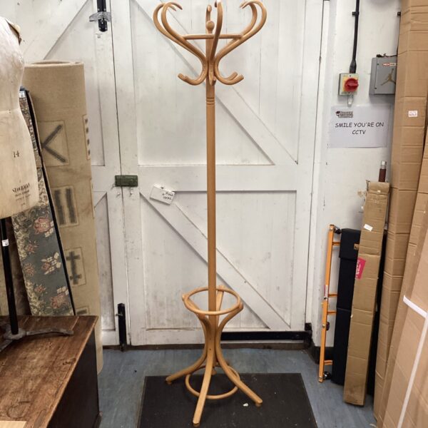 Vintage wooden coat stand with curved arms for coats and umbrellas.