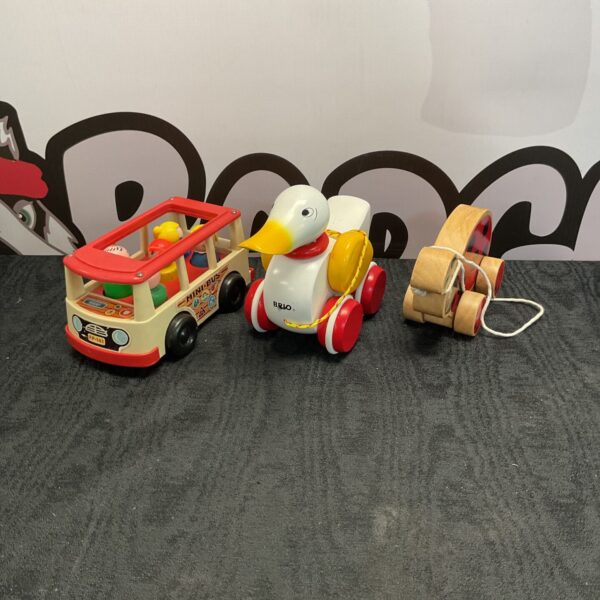 Vintage Fisher Price mini bus with Brio duck pull along toy.