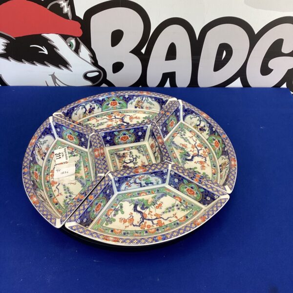 Vintage Japanese Imari porcelain serving set with intricate design.