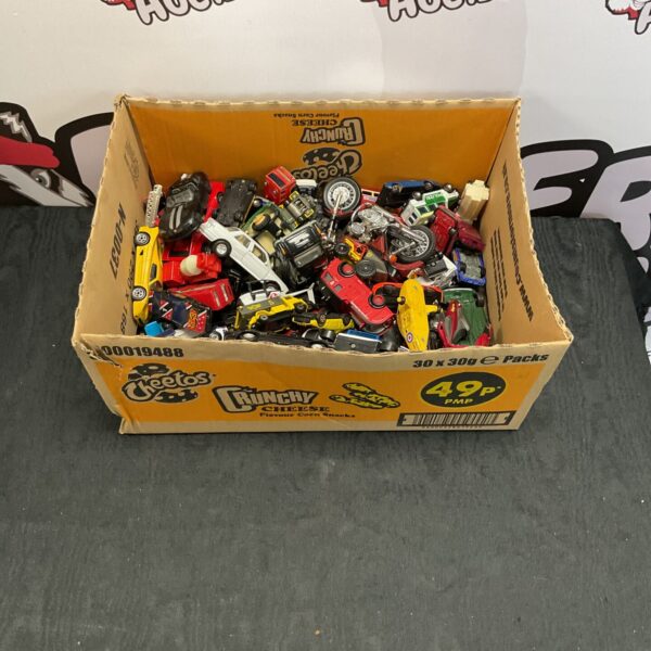 Mixed lot of diecast model cars in original packaging.