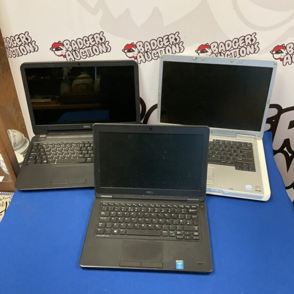 Lot of three used Dell laptops for parts or repair.