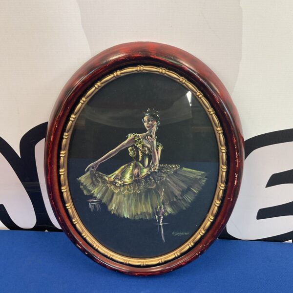 Vintage oil painting of a ballerina by D Jagessolf in a gold frame.