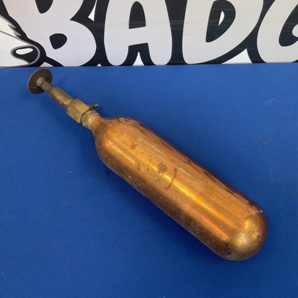 Vintage brass fire extinguisher for classic cars and collectors.