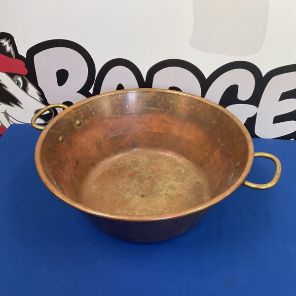 Vintage copper jam pan with sturdy brass handles for preserving.