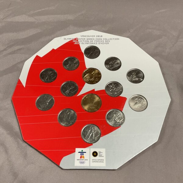 Front view of the Vancouver 2010 Olympic coin collection in red holder.