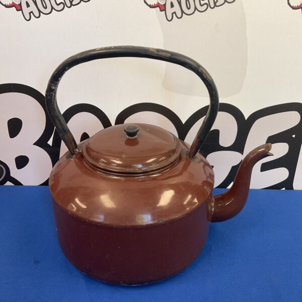 Dark coloured vintage enamelled teapot, classic kitchenalia collectible.