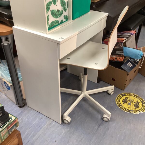 White bedroom desk unit with chair for small spaces.