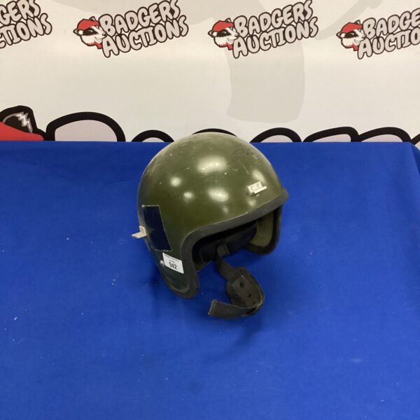Front view of a weathered vintage military steel helmet.