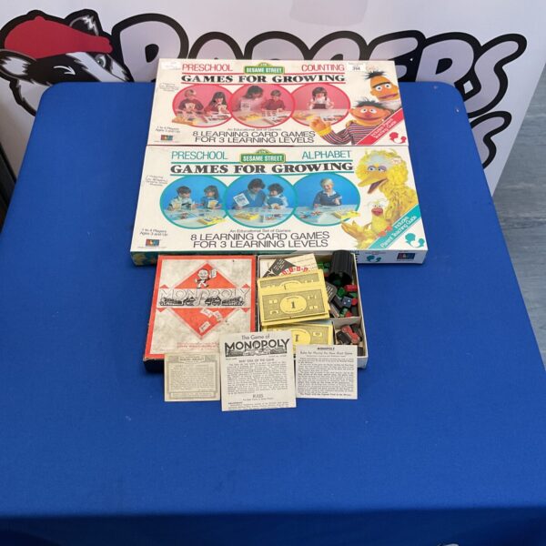 Vintage Sesame Street and Waddingtons Monopoly board games lot.