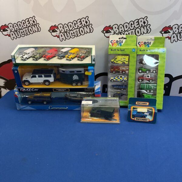 Diecast vehicle collection featuring Corgi, Matchbox, and Cararama models.