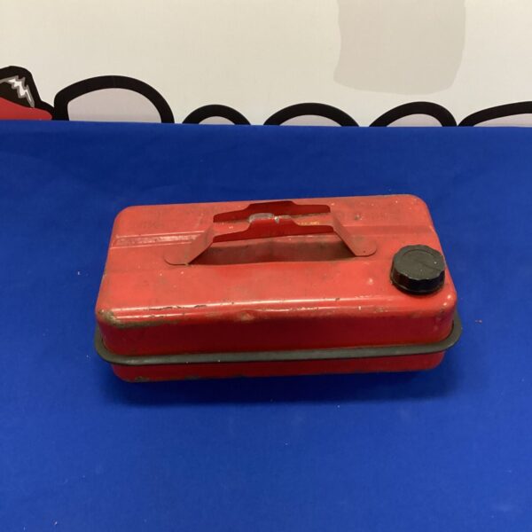 Front view of a vintage metal petrol can.
