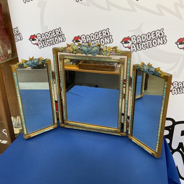 Vintage Art Nouveau dressing table mirror with floral details.