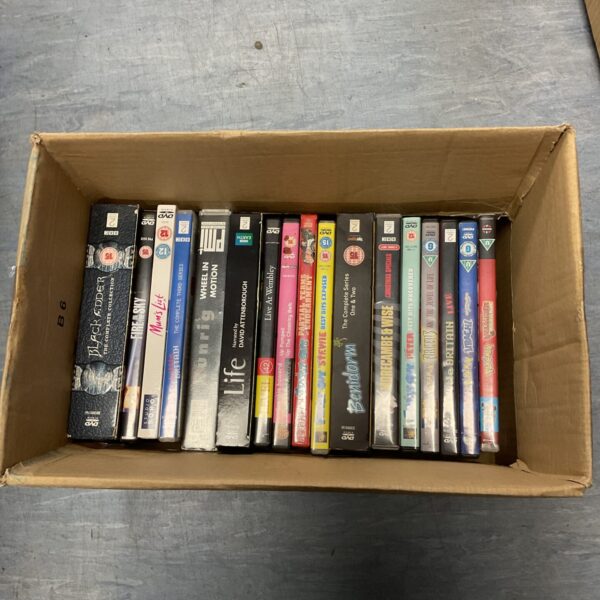 Blackadder DVD boxset and collection of DVDs in a cardboard box.