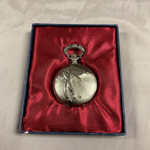 Silver golf pocket watch with golfer design.