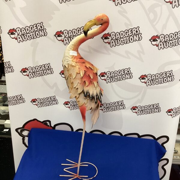 Vintage metal flamingo garden ornament for outdoor display.
