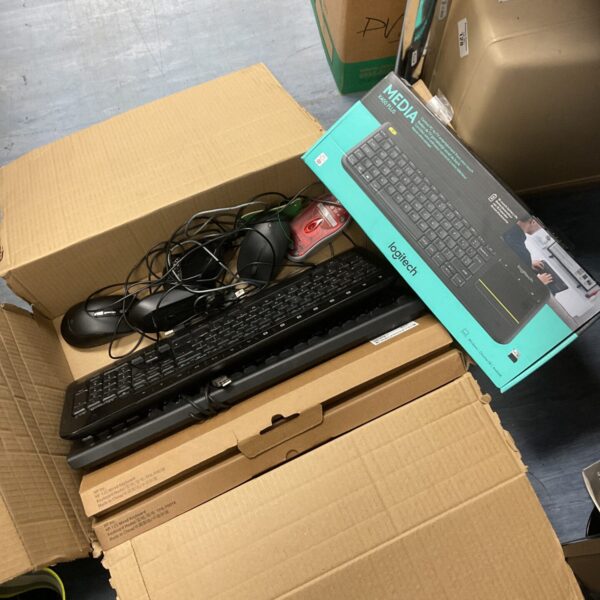 Boxed keyboards and mice lot including Logitech and HP peripherals.