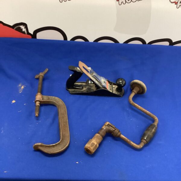 Vintage G-clamp for woodworking, showing signs of age.