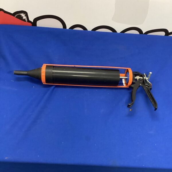 Metal grouting gun for tile and masonry work.