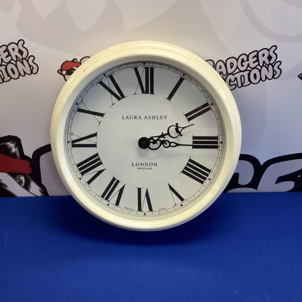 White faced Laura Ashley kitchen clock for vintage farmhouse decor.
