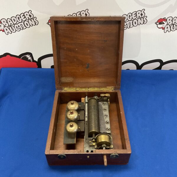 Antique 19th-century Swiss music box in rosewood case.