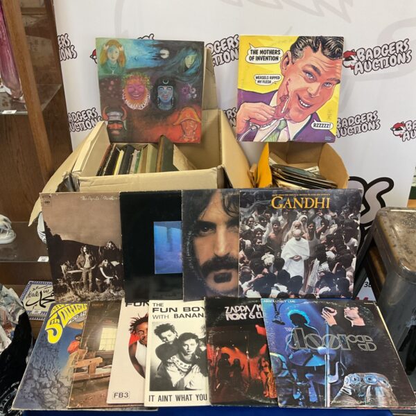 Vinyl record collection featuring Frank Zappa and The Doors albums.