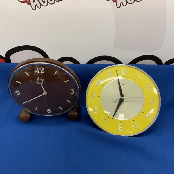 Pair of vintage Metamec electric clocks in unrestored condition.