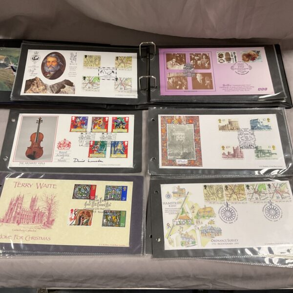 First day covers album with various commemorative stamp designs.