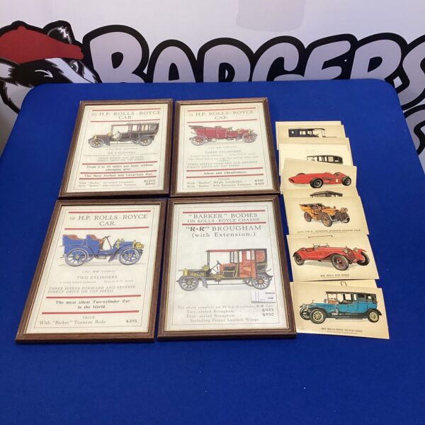 Framed collection of vintage Rolls Royce advertisements for collectors.