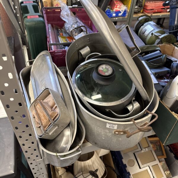 Large stainless steel commercial kitchen hood for ventilation.