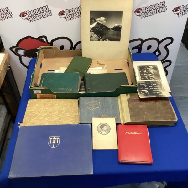 Lot of vintage photo albums with antique photographs.